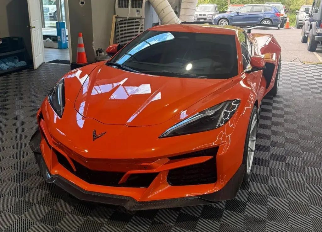 Orange Corvette C8 inside Deluxe Paint Protection's shop in Chantilly, Virginia